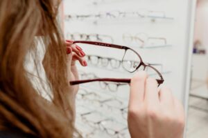 Woman choosing prescription eyeglasses